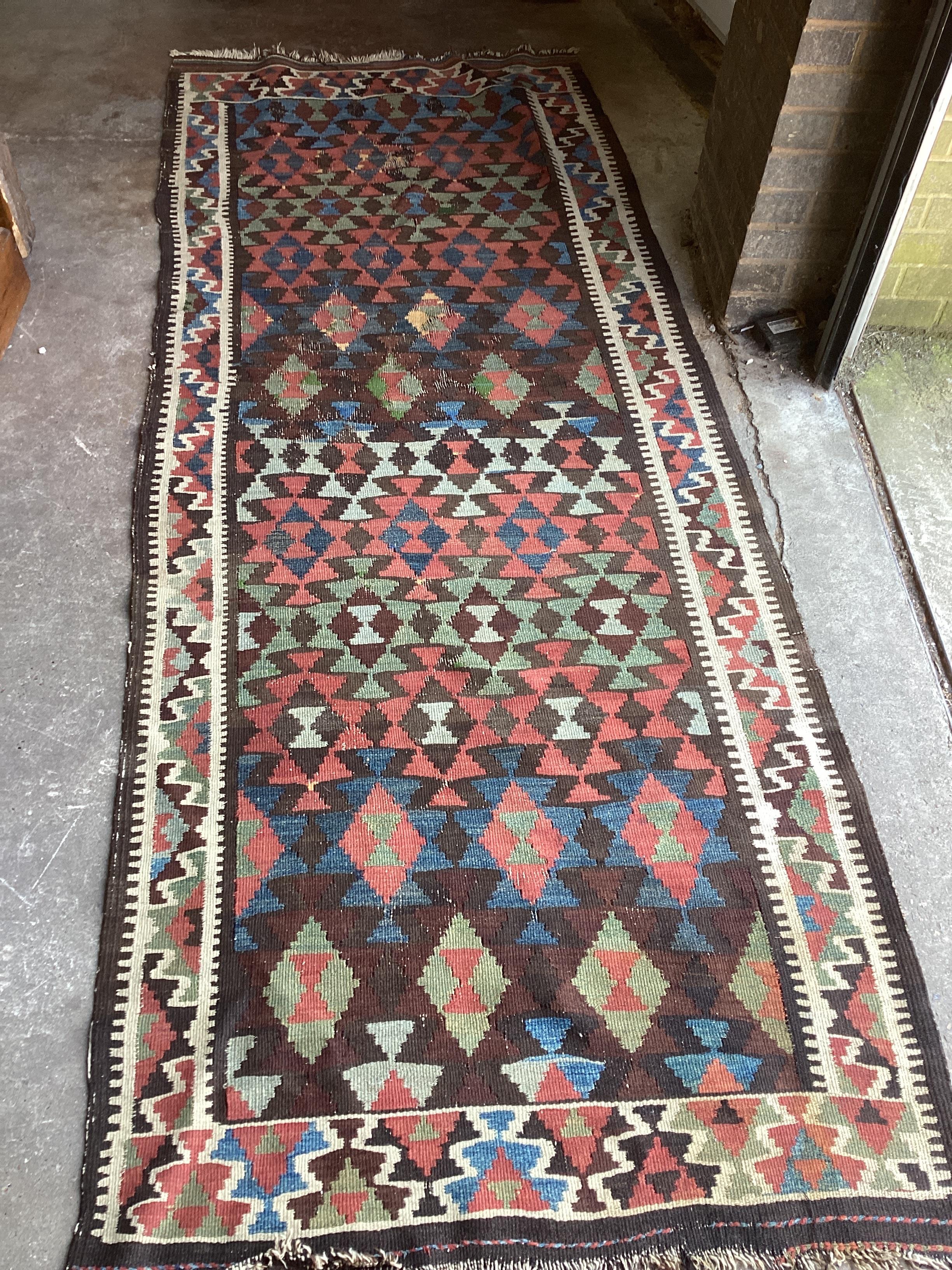 A Kelim polychrome flatweave runner, 286 x 109cm